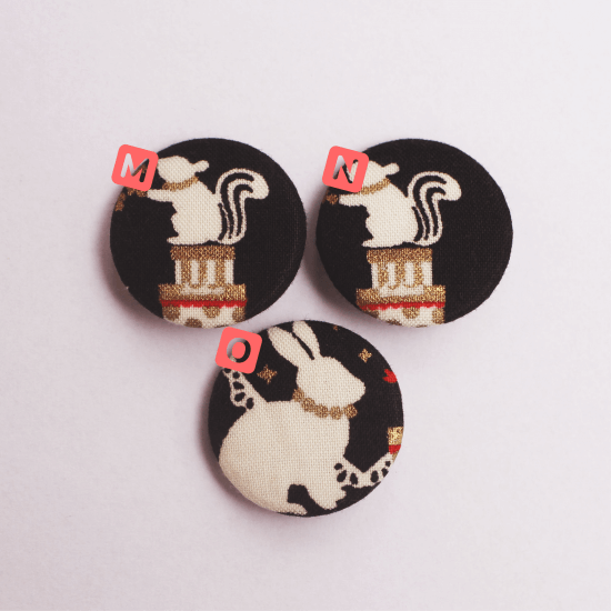 Textile badge with Christmas silhouette pattern